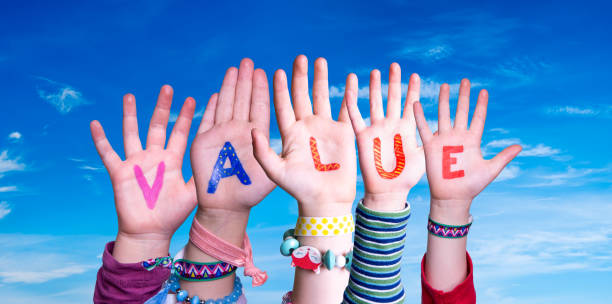 istock Children Hands Building Word Value. Blue Sky 1622621124
