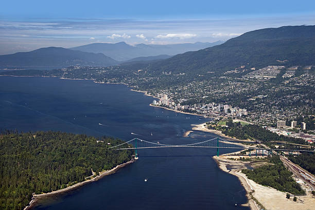 Strait of Georgia and West Vancouver Vancouver - Lions Gate Bridge, West Vancouver and Coast Mountains west vancouver stock pictures, royalty-free photos & images