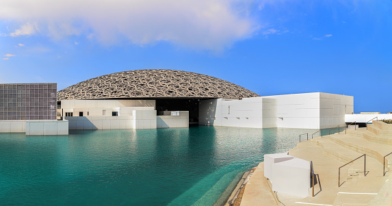 Abu Dhabi, United Arab Emirates - February 28. 2023: The exterior of the famous Louvre museum in Abu Dhabi. It is the most visited museum in Arabic world.