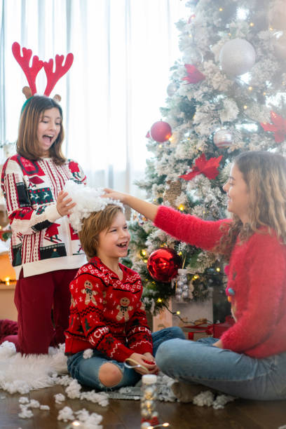 istock Children playing during Christmas time at home 1622632492