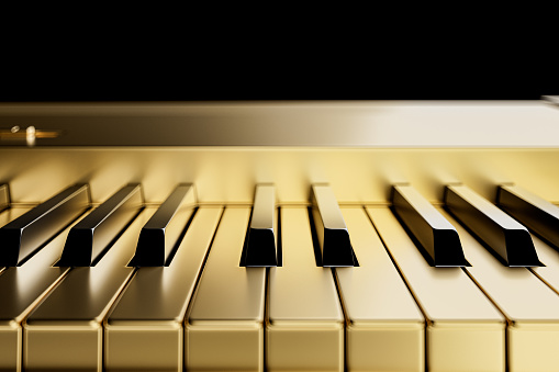 3d illustration digital piano or synthesizer made of gold. Front view closeup of 3d render of piano keys