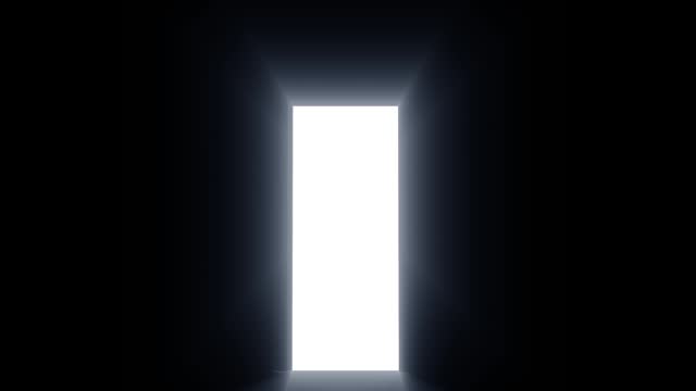 Light entering through open door to a dark empty room
