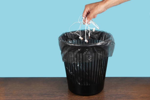 istock Hand throwing old shabby decrepit headphones away, trash bin, electronic waste, goodbye gadget addiction concept 1622650544