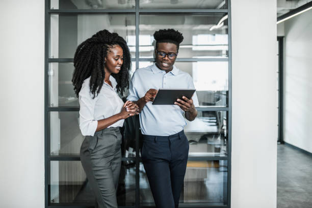 istock Two young black people working in an office 1622652167