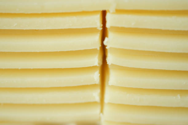 Slicing cheese into pieces closeup, ,