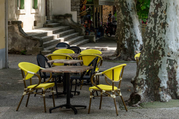 istock Brightly coloured chairs at pavement tables 1622669742