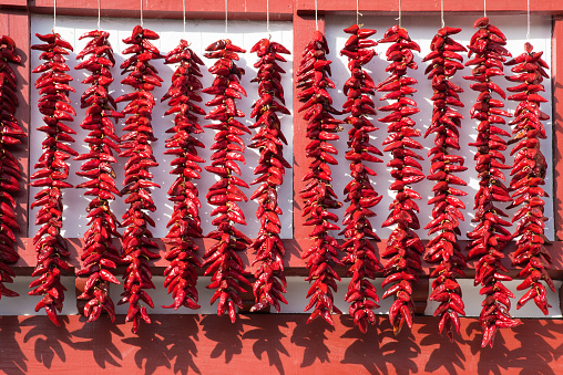 Red Espelette peppers on the wall of a Basque house