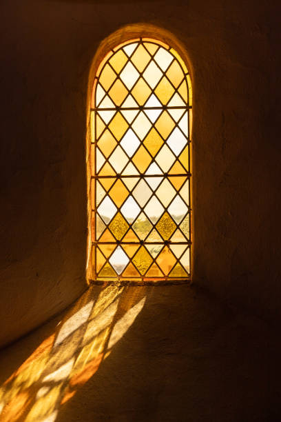 istock sun is shining through a window of a church 1622682446