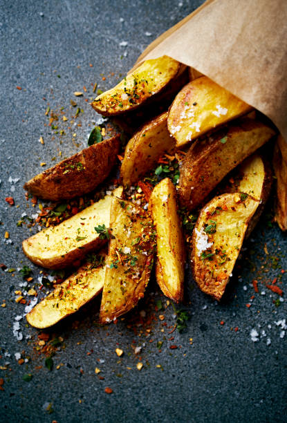 istock Spicy potato wedges in a paper bag 1622683644