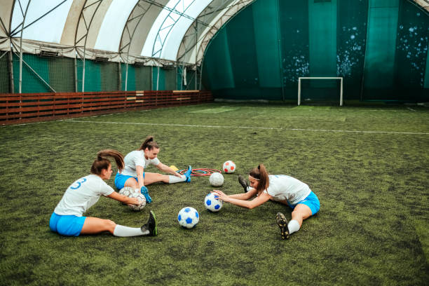 istock Female soccer players warming 1622700937