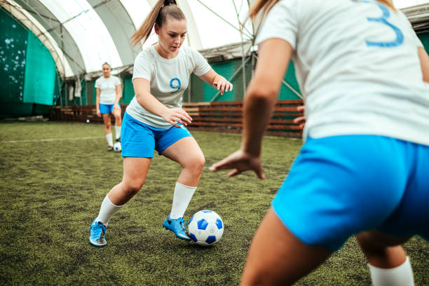 istock Soccer players in action on a playing field 1622703965