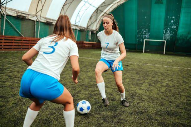 istock Soccer players in action on a playing field 1622704095