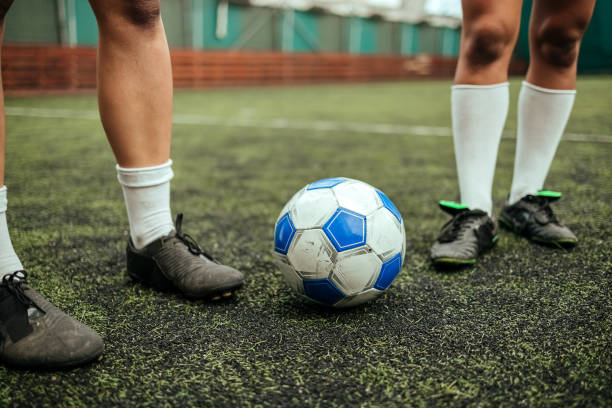istock Soccer players in action on a playing field 1622707290
