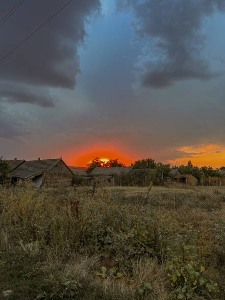 istock Village. Sunset. Sun. Aesthetics. background. House 1622711694