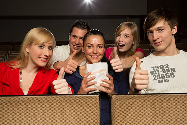 istock People in a movie theatre having fun 162271363