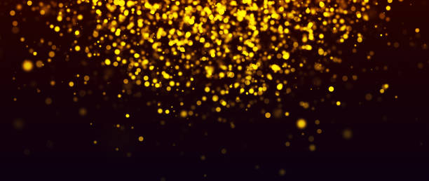 istock Golden particles shining dust bokeh glitter awards abstract background. 1622724500