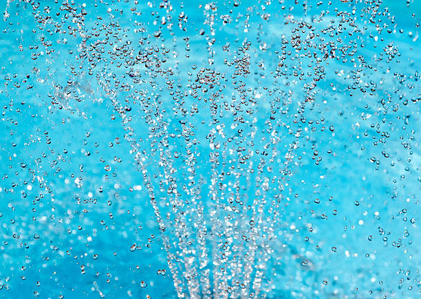 istock Water spray fountain on turquoise background 162272735