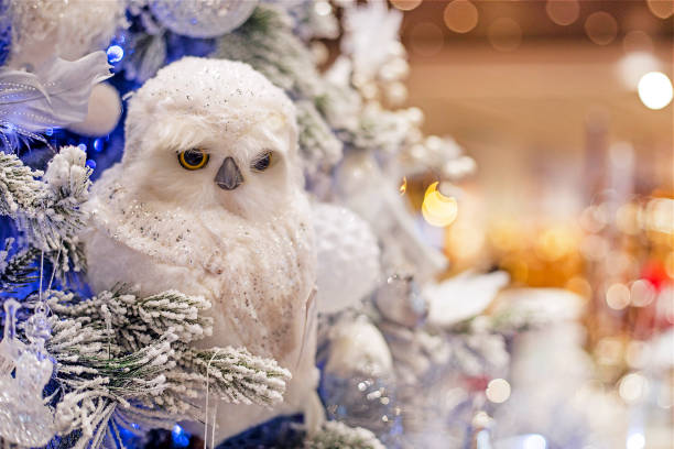 istock white decorative owl on a christmas tree with decorations. Christmas and New Year 1622735288