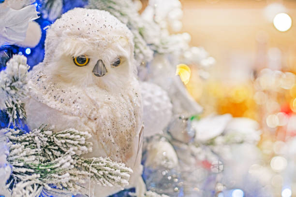 istock white decorative owl on a christmas tree. Christmas and New Year 1622735647