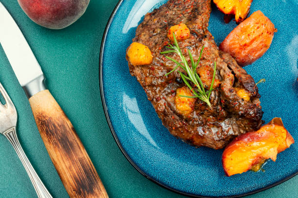 istock Grilled beef meat steak with peach. 1622736327