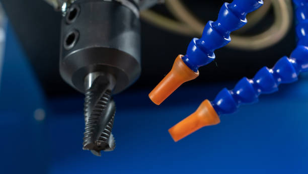 istock CNC milling cutter with blue cooling flexible tubes 1622754070