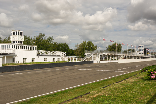 Start / Finish straight with pits buildings at Goodwood Motor Racing Circuit in West Sussex, England.
