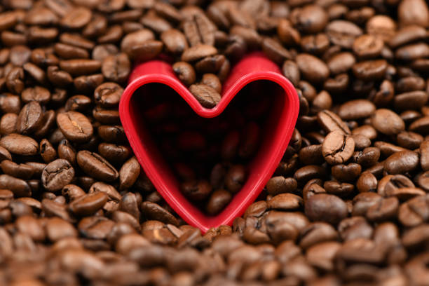Close up of white coffee cup and coffee beans