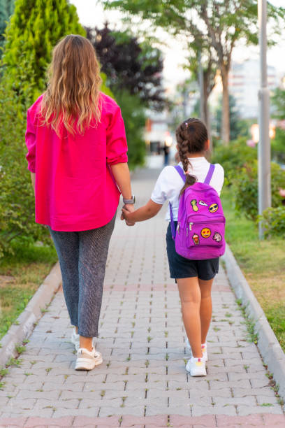 istock Mother Taking her Daughter to School 1622787188