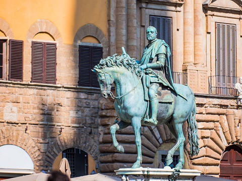 Bronze statue of Cosimo Medici sitting on a horse, in a square near the Palazzo Vecchio in Florence, Italy