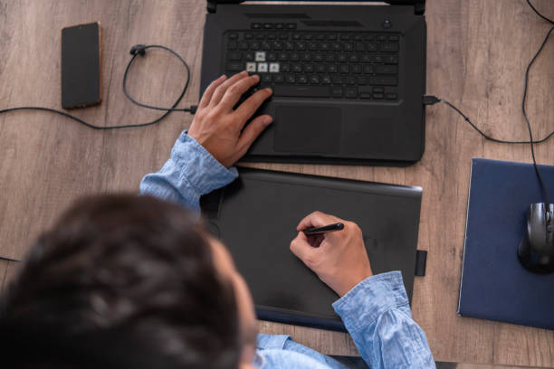 istock Digital illustration creator in his home office 1622797486