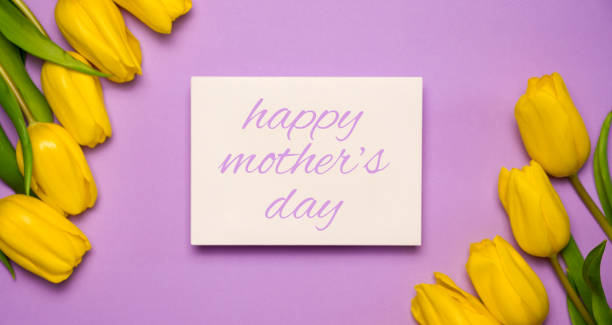 istock Spring background with yellow tulips and empty card for text. Happy mother's day 1622800624
