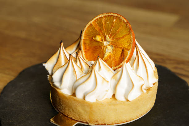 istock Orange cake with cream on top 1622809855