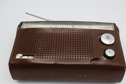 vintage golden fm radio isolated on white