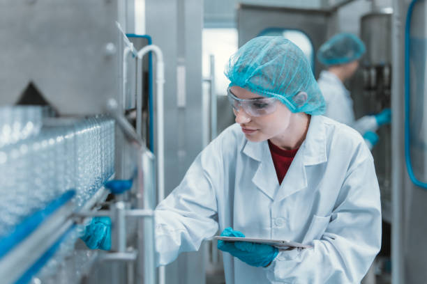 istock Supervisors check automated bottling for sequence accuracy, safety, reliability at water pipeline. 1622821116