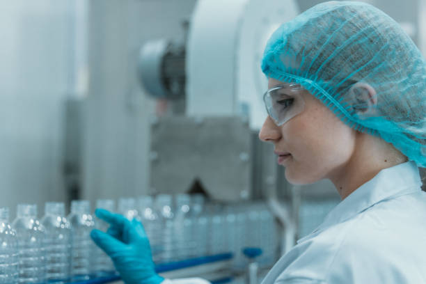 istock Supervisors check automated bottling for sequence accuracy, safety, reliability at water pipeline. 1622823309