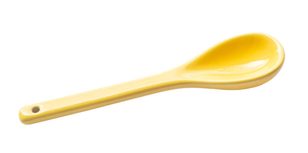 istock yellow ceramic tea spoon cutout on white 1622825474