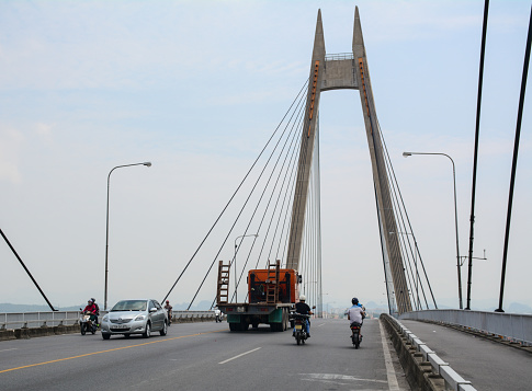 Hai Phong, Vietnam - May 21, 2016. Traffic on the Binh Bridge in Hai Phong, Vietnam. Hai Phong is a major port city in northeastern Vietnam, across from Cat Ba Island.