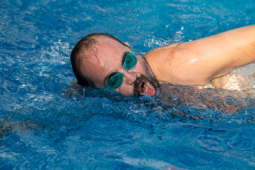 Action Image of a senior male swimmer