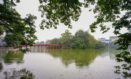 Hoan Kiem Lake at rainy day in Hanoi, Vietnam. From 1010 until 1802, Hanoi was the most important political centre of Vietnam.