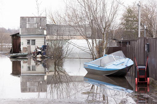 A flooded house and garden plot during the spring flood.
