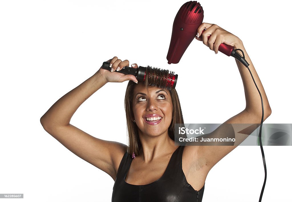 Femme Cheveux Peignage et lisser avec Souffleur - Photo de Agripper libre de droits