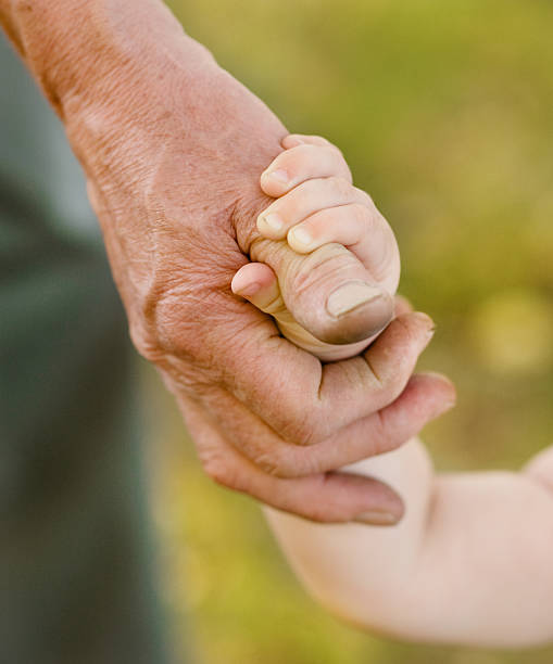 istock hands grandson and grandfather 162286464