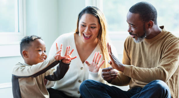 istock Mixed race family with young boy, counting with fingers 1622867478