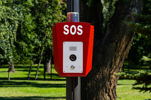 SOS, police, emergency button in the public park