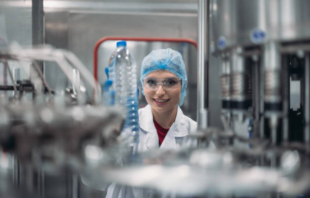 istock Supervisors check automated bottling for sequence accuracy, safety, reliability at water pipeline. 1622880447