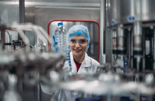 istock Supervisors check automated bottling for sequence accuracy, safety, reliability at water pipeline. 1622880450