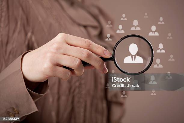 Human Resources And Crm Stock Photo - Download Image Now - Magnifying Glass, Adult, Brown