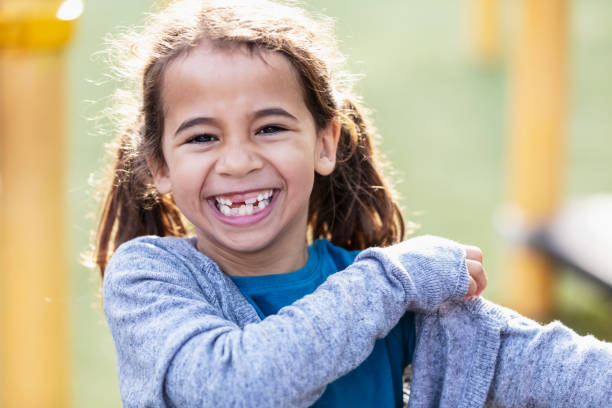 istock Mixed race girl smiling at the camera 1622884254