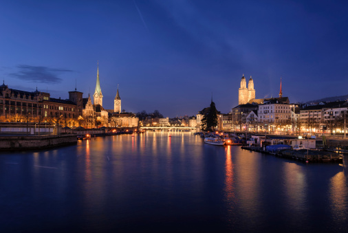 Zurich city center viewed from the river by night. Switzerland.