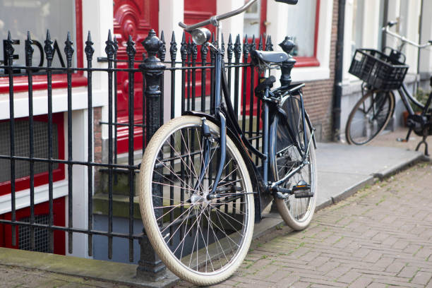 istock Bicycle chained to railings outside a building 1622918324